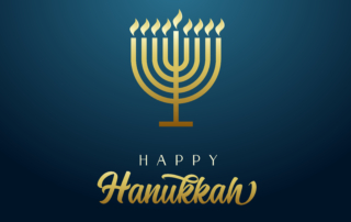 Happy Hanukkah golden menorah, candles and flame light on blue background.